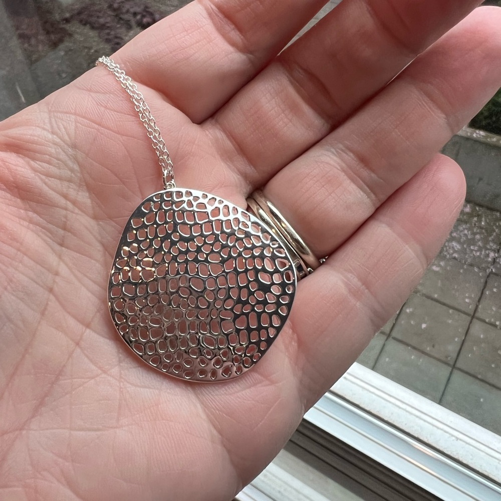 Adjustable silver necklace by Gorjana with free form pendant